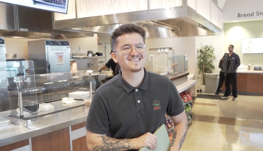 cafe manager smiling at camera