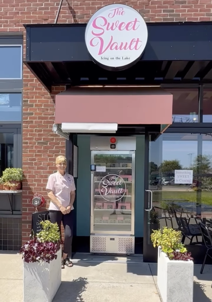 woman standing in front of smart fridge microstore.