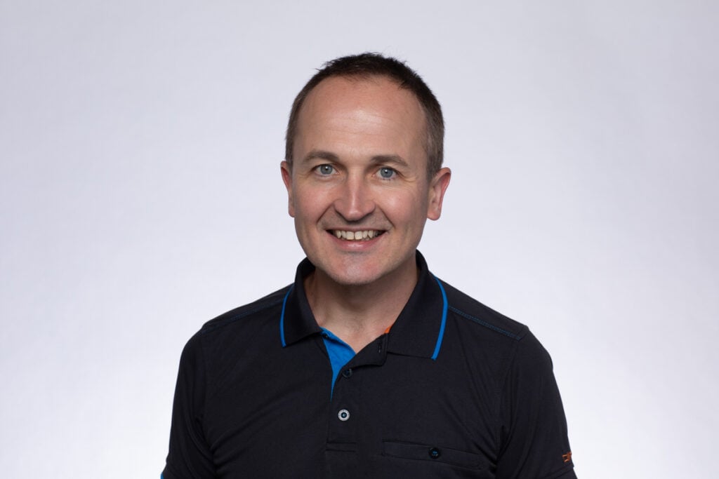 Smiling man over a white background