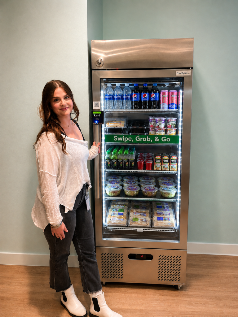 woman standing along side smart fridge